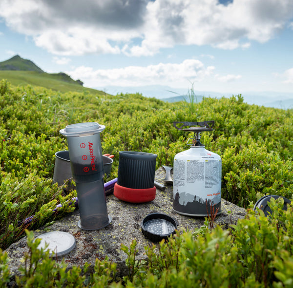 https://www.rossstreetroasting.com/cdn/shop/products/AeroPress-Go-on-rock-on-hillside-in-Ukraine_600x.jpg?v=1675617525